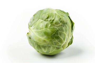 Obraz premium Close-up of a fresh head of cabbage on a white surface