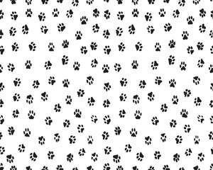 Seamless pattern of black silhouettes of prints of dog paw	