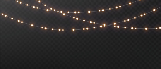 Christmas string lights isolated. Glowing realistic garlands on dark background. Holiday shimmering lights.