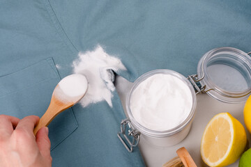 Natural cleaning method to remove sweat stains under the armpits. Eco-friendly remove stains from clothes using baking soda. Embracing a zero-waste lifestyle. top view.