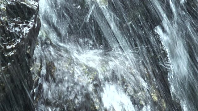 Slow motion, closeup shot of splash of the brook, cascade. 4K
