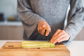 Young mommy cooking healthy vegetable meal for baby. Correct food is crucial for health.