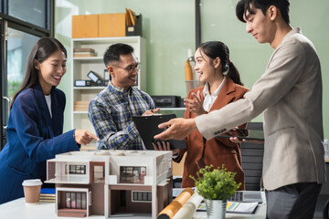 Engineer Teamwork Meeting, Drawing working on blueprint meeting for project working with partner on model building at company office. Asian industry professional team