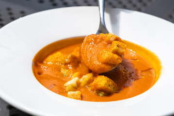 Creamy tomato soup or bisque with croutons, delicious rich smooth texture, perfect healthy lunch