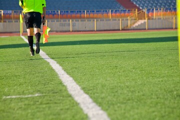 STADIUM - Football field with goal and tablo on blue sky