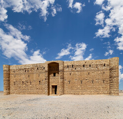 Qasr Kharana (Kharanah or Harrana)-- desert castle in eastern Jordan (100 km of Amman). Built in 8th century AD to be used as caravanserai, a resting place for traders. Against the sky with clouds