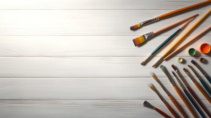 Obraz premium Paint Brushes and Acrylic Paints on White Wooden Table