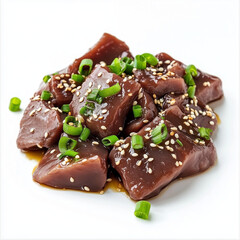 Cubes of Marinated Liver with Green Onions and Sesame Seeds on White Plate