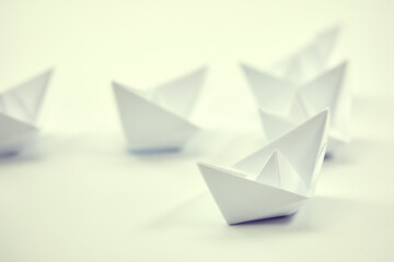 paper boats on the document