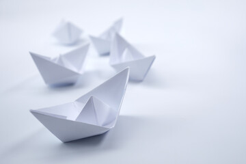 paper boats on the document