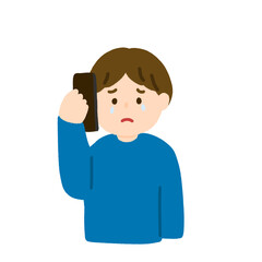 電話をしながら悲しむ男性