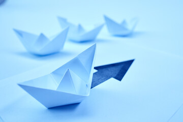 paper boats on the document