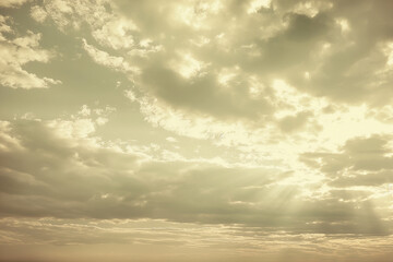 Fototapeta premium A vintage cloudy sky background featuring a serene expanse of softly textured clouds drifting across a muted, antique sky