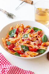 Pasta penne alla arrabiata with tomatoes, basil and parmesan cheese. Healthy Eating. Vegetarian Food.