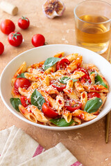 Pasta penne alla arrabiata with tomatoes, basil and parmesan cheese. Healthy Eating. Vegetarian Food.