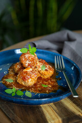 Italian meatballs in tomato sauce with fresh basil