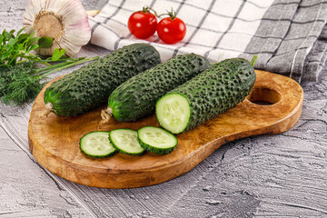 Raw green cucumbers with slices
