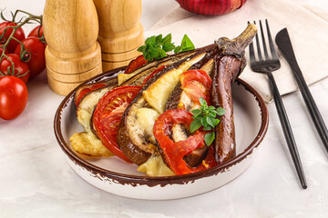 Baked tomato with mozzarella and tomato