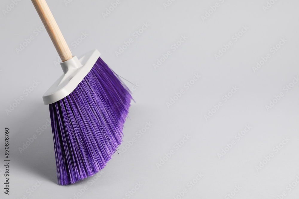 Wall mural One cleaning broom on grey background, space for text