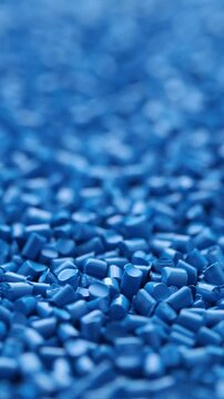 Close-up of blue colour masterbatch. Pigments for plastic injection moulding. Rotating view 