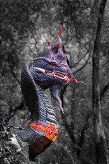 The Naga statue at Tham Chaimongkol Cave Temple is more than just a sculpture; it is a spiritual embodiment of peace and tranquility