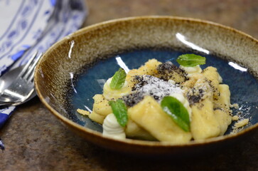 A beautifully plated serving of traditional Czech potato dumplings, known as 