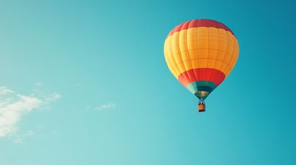 Fototapeta premium Colorful Hot Air Balloon Soaring in Blue Sky