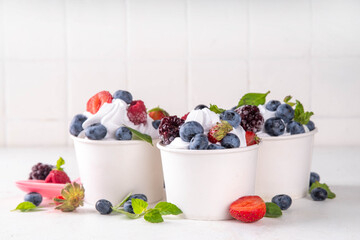 Frozen yogurt dessert with various berry toppings © ricka_kinamoto
