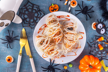 Spaghetti pasta with sausages mummies