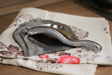 a brush and a dustpan for crumbs on the table