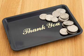 Thank you tip with a tray and money