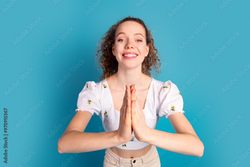 Sticker Photo portrait of attractive young woman pray gesture dressed stylish white clothes isolated on blue color background