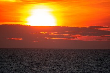 Latvia Rigas Gulf Jurkalne sunset into the sea in the clouds