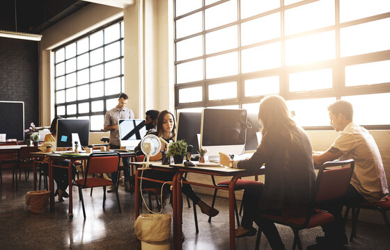 Business people, startup and computer in office, creative agency and planning with project. Design company, employees and coworkers with pc, internet and journalist with copywriting and coworking