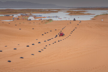 The car going through the Gobi desert in Inner Mongolia, China.