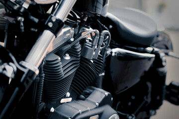 Black motorcycle engine with two V-cylinders