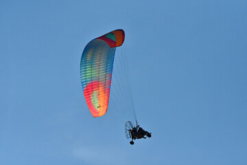 A hang glider pilot in the air