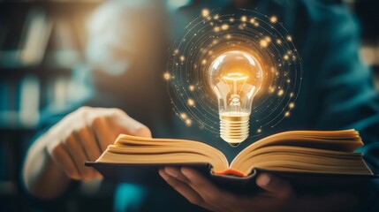 Man hand holding lightbulb with learning book educate and graduation concept. study knowledge to creative thinking idea and problem solving solution learning education course degree certificate