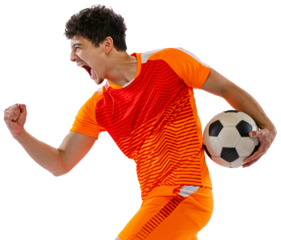 Winner emotions. Portrait of young man, football, soccer player posing with ball, wearing orange uniform isolated on white transparent background. Concept of sport, competition, active lifestyle, game