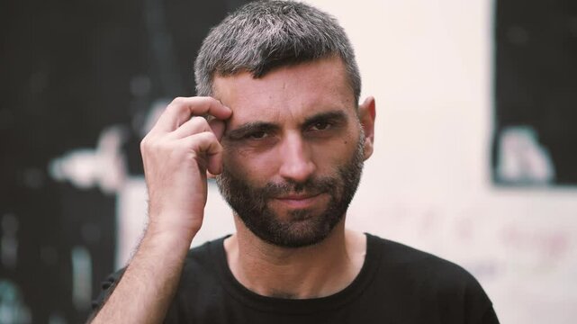 Medium shot of a man looking extremely perplexed while trying to solve a problem. His expression and body language convey a sense of frustration and confusion.
