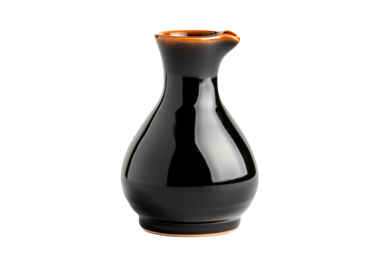 A sleek black teapot of soy sauce with a red cap isolated on a white transparent background. Condiment concept.