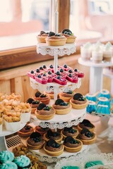 Assorted pastries and desserts on a tiered stand.