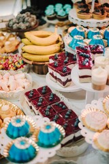 Colorful dessert and fruit display on a table.