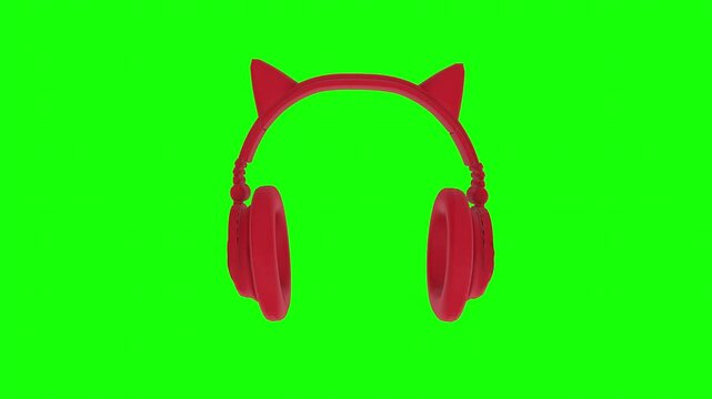 Red cat ear headphones on a bright green background