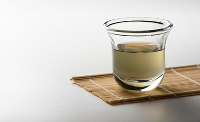 Alcohol in a shot glass on a white background