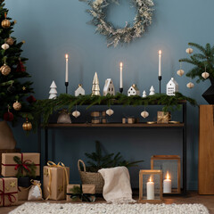 Cozy and stylish christmas living room interior with, modular sofa, wooden console with spruce,...