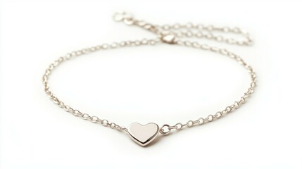 A thin silver chain bracelet with a small heart pendant, solid white background