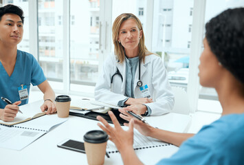 Doctor, review and medical students with talking as group for healthcare, meeting or feedback....