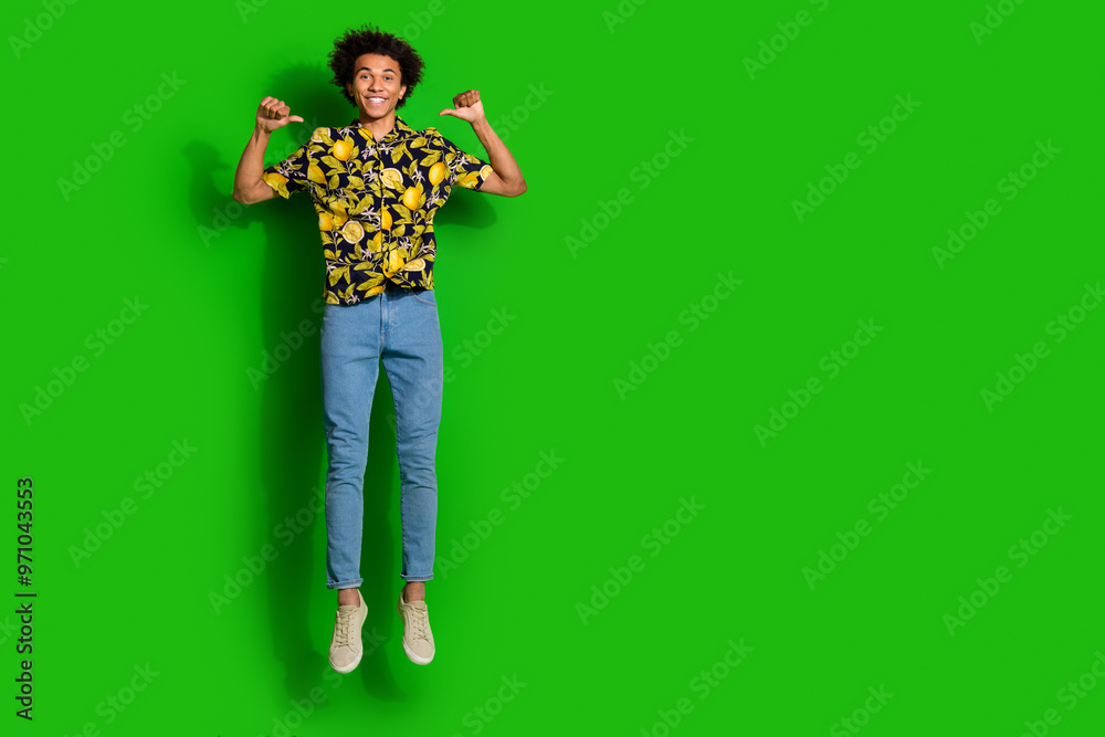 Canvas Prints Photo of optimistic positive man wear stylish denim summer print clothes empty space isolated on green color background