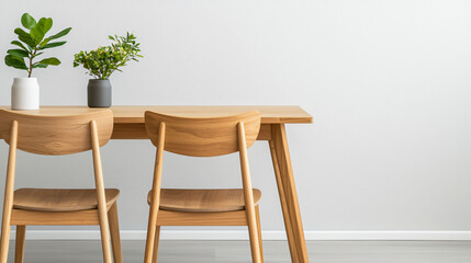 Modern teak dining set with clean lines and geometric design, featuring two wooden chairs and decorative plants in minimalist vases, creating serene dining atmosphere